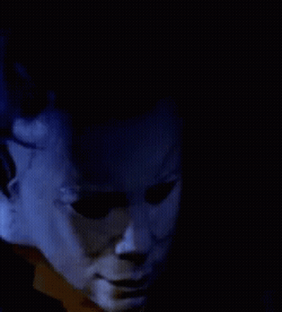 A Close Up Of A Person Talking On A Phone GIF