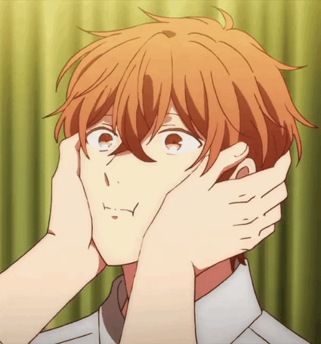 A Close Up Of A Person Touching Another Person 'S Face With Their Hands GIF