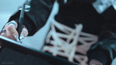 A Close Up Of A Person Using A Pen On A Tablet With A Gifscaespa Watermark GIF