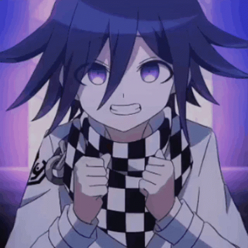 A Close Up Of A Person Wearing A Black And White Checkered Scarf GIF