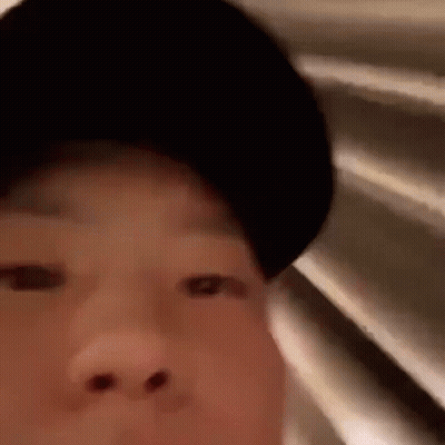 A Close Up Of A Person Wearing A Black Hat . GIF