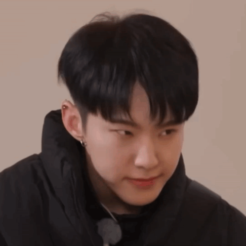 A Close Up Of A Person Wearing A Black Jacket GIF