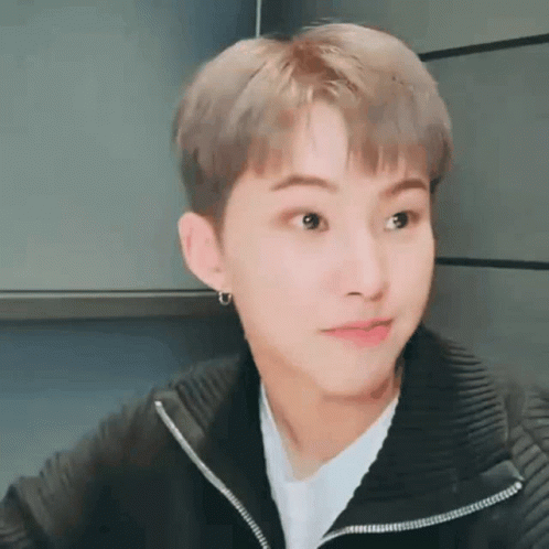 A Close Up Of A Person Wearing A Black Jacket And A White Shirt . GIF