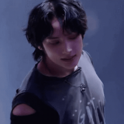 A Close Up Of A Person Wearing A Black Shirt With A Microphone On It . GIF