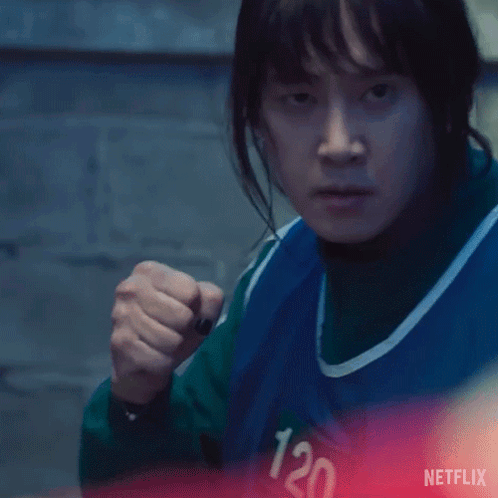 A Close Up Of A Person Wearing A Blue Vest With The Number 120 On It GIF