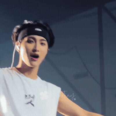 A Close Up Of A Person Wearing A Headband And A White Shirt GIF