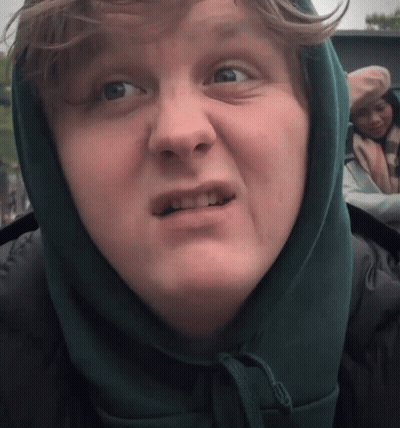 A Close Up Of A Person Wearing A Hooded Jacket GIF