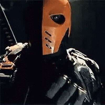 A Close Up Of A Person Wearing A Mask And Holding A Bow And Arrow . GIF