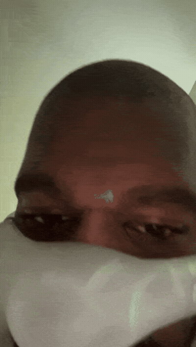 A Close Up Of A Person Wearing A Mask GIF