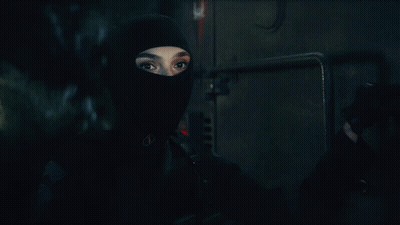 A Close Up Of A Person Wearing A Mask GIF