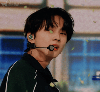 A Close Up Of A Person Wearing A Microphone In Their Ears . GIF