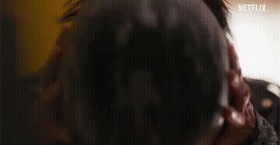 A Close Up Of A Person Wearing A Red Helmet And Sunglasses . GIF