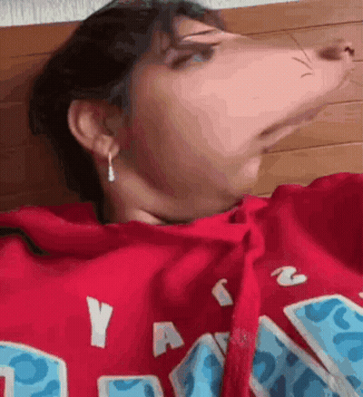 A Close Up Of A Person Wearing A Red Hoodie . GIF