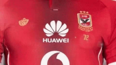 A Close Up Of A Person Wearing A Red Huawei Soccer Jersey . GIF
