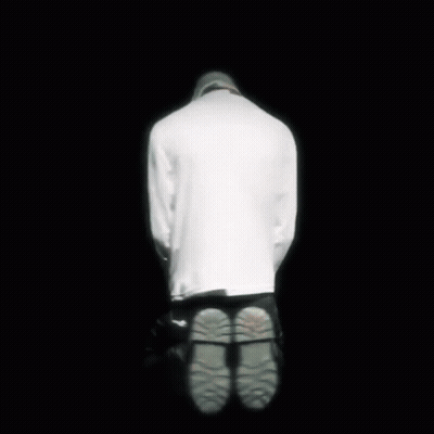 A Close Up Of A Person Wearing A Shirt That Says Killer On It . GIF