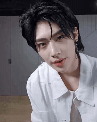 A Close Up Of A Person Wearing A White Shirt GIF