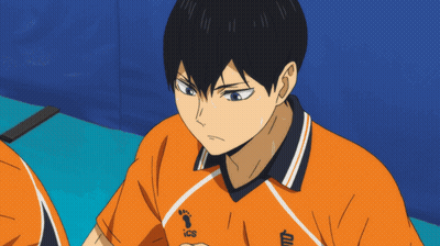 A Close Up Of A Person Wearing An Orange Shirt With Ics On It GIF
