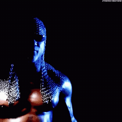 A Close Up Of A Person Wearing Chain Mail And Sunglasses . GIF