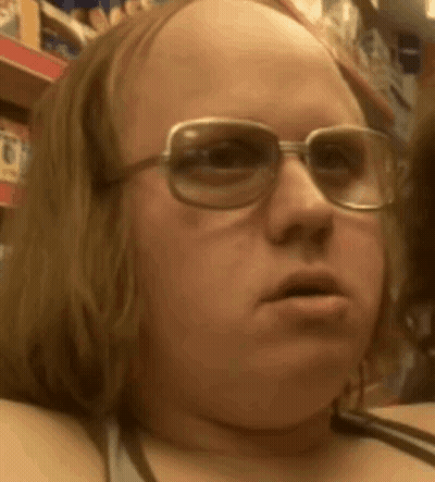 A Close Up Of A Person Wearing Glasses And A Bald Head . GIF