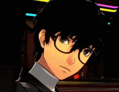 A Close Up Of A Person Wearing Glasses And A Black Suit GIF