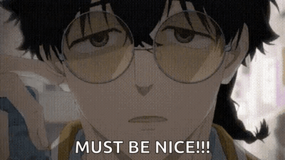 A Close Up Of A Person Wearing Glasses And A Braid . GIF