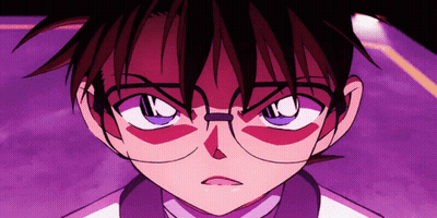 A Close Up Of A Person Wearing Glasses And A White Shirt GIF