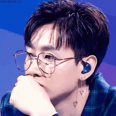 A Close Up Of A Person Wearing Glasses And Ear Buds With The Words Fdxdyzlm Above GIF