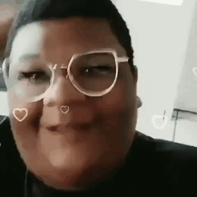 A Close Up Of A Person Wearing Glasses And Making A Face . GIF