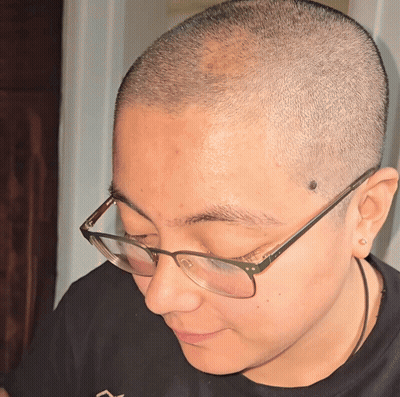 A Close Up Of A Person Wearing Glasses GIF