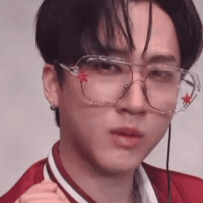 A Close Up Of A Person Wearing Glasses With A Red Star On Them . GIF