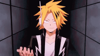 A Close Up Of A Person Wearing Headphones And A Jacket In A Dark Room . GIF