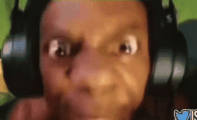 A Close Up Of A Person Wearing Headphones And Making A Face GIF