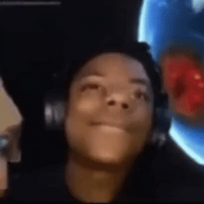 A Close Up Of A Person Wearing Headphones Looking Up At The Camera . GIF
