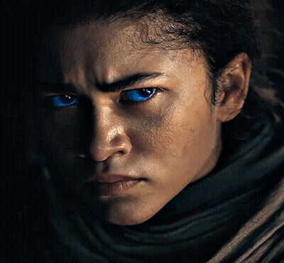 A Close Up Of A Person With Blue Eyes GIF