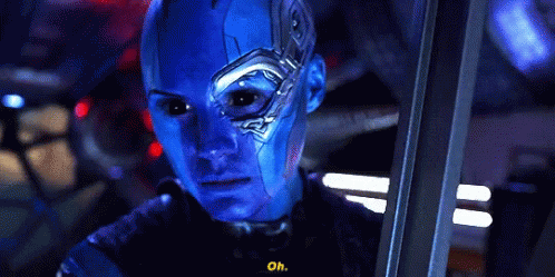 A Close Up Of A Person With Blue Paint On Their Face And The Words Oh On The Bottom GIF