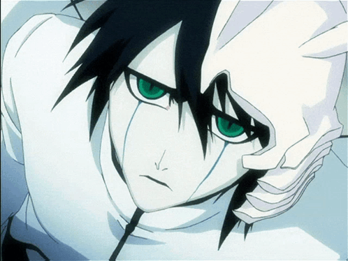 A Close Up Of A Person With Green Eyes And Black Hair GIF