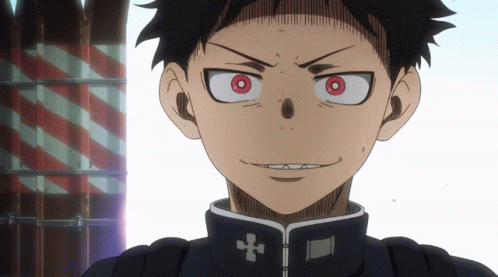 A Close Up Of A Person With Red Eyes And A Cross On Their Jacket GIF