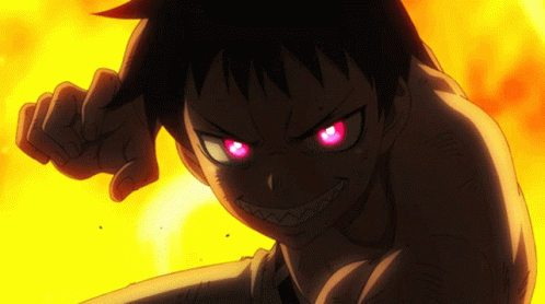 A Close Up Of A Person With Red Eyes And Teeth GIF