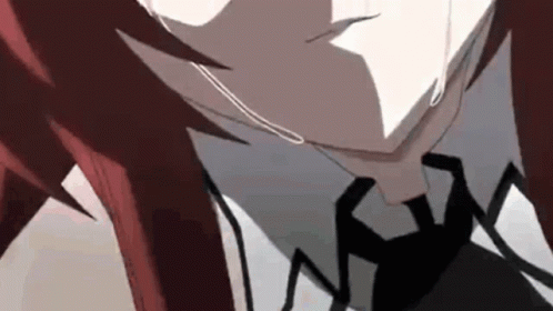 A Close Up Of A Person With Red Hair And A Black Tie . GIF