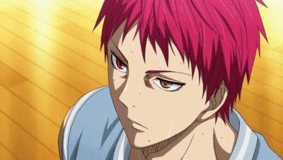 A Close Up Of A Person With Red Hair And Orange Eyes GIF