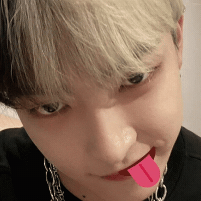 A Close Up Of A Person With Their Tongue Out GIF