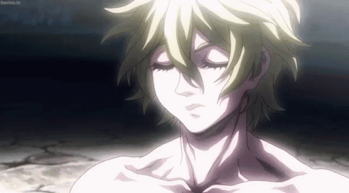 A Close Up Of A Person Without A Shirt With Their Eyes Closed In A Dark Room . GIF