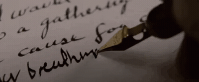 A Close Up Of A Person Writing With A Fountain Pen On A Piece Of Paper . GIF