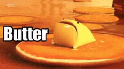 A Close Up Of A Piece Of Butter On A Pancake GIF