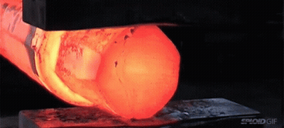 A Close Up Of A Piece Of Metal Being Heated By A Machine . GIF