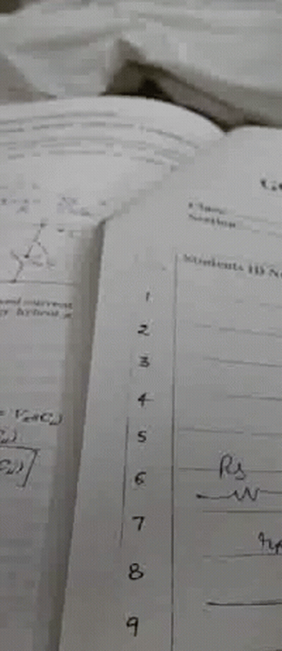 A Close Up Of A Piece Of Paper With A Row Of Numbers Written On It . GIF
