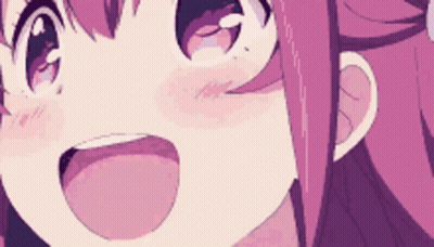 A Close Up Of A Pink Haired Anime Girl 'S Face With Her Tongue Out . GIF