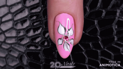 A Close Up Of A Pink Nail With A Flower Design Made In Animatica GIF