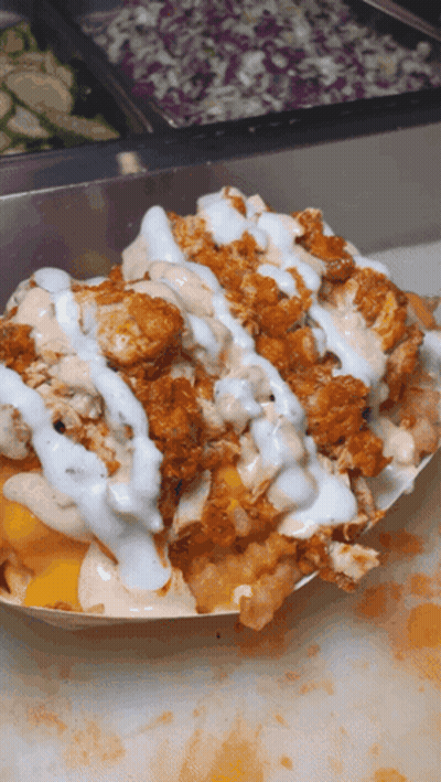 A Close Up Of A Plate Of Food With Sauces On Top GIF