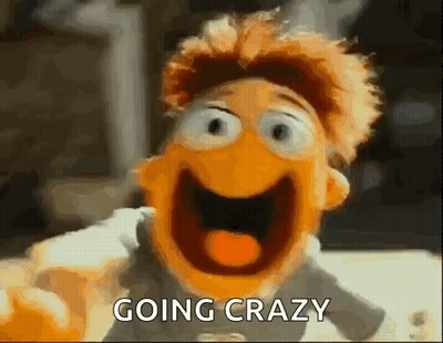 A Close Up Of A Puppet With Its Mouth Open And The Words `` Going Crazy '' Written Above It . GIF